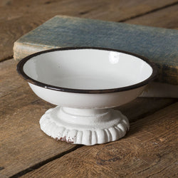a white toilet sitting on top of a wooden floor 