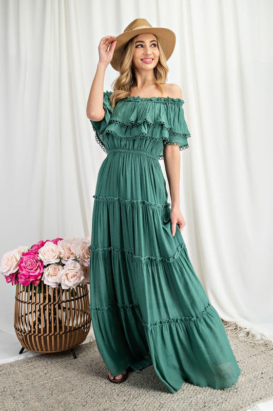 Shop this elegant and swingy maxi dress in green made in an off the shoulder look with tiered ruffle accents.