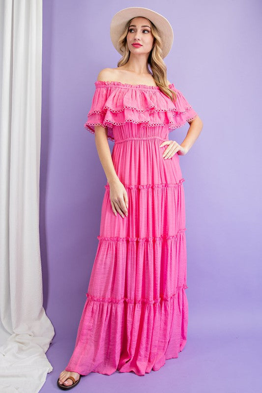 Shop this elegant and swingy maxi dress in pink made in an off the shoulder look with tiered ruffle accents.