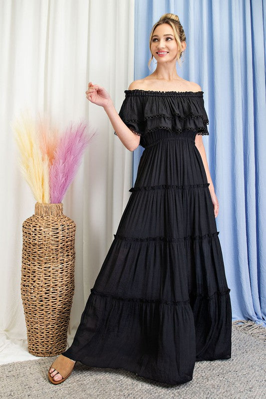 Shop this elegant and swingy maxi dress made in an off the shoulder look with tiered ruffle accents.