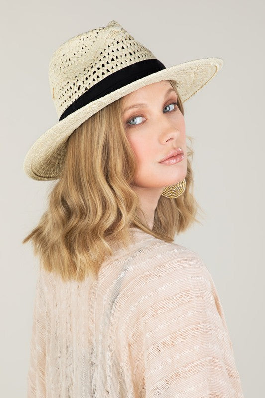 a woman wearing a hat and a hat 