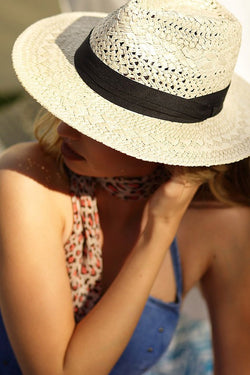 a woman wearing a hat and a hat 