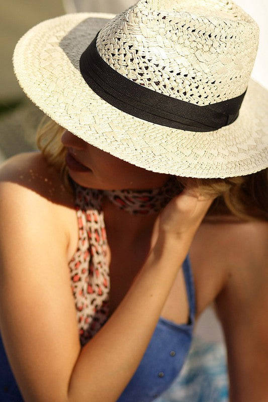 a woman wearing a hat and a hat 