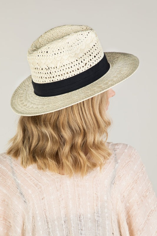 a woman wearing a hat and a hat 