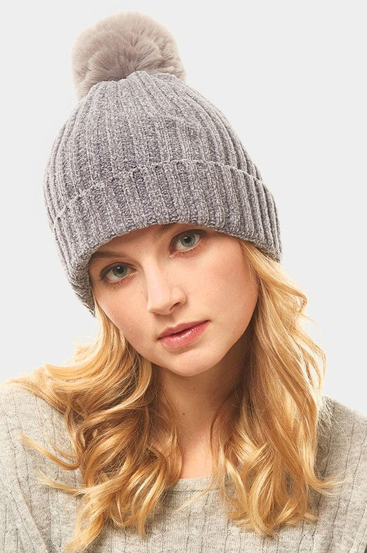 a woman wearing a hat and a hat 