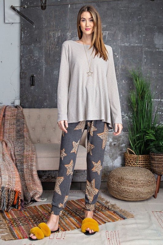 a woman is standing in front of a wall 