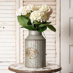 a close up of a vase with flowers in it 