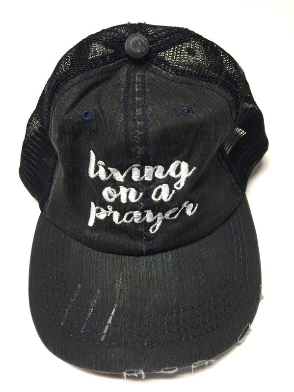 a black hat on top of a baseball glove 
